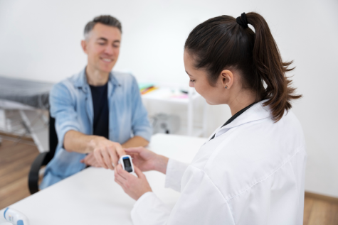 Doctor checking patient’s blood sugar with glucometer – TrustScape Diabetes Reversal Program